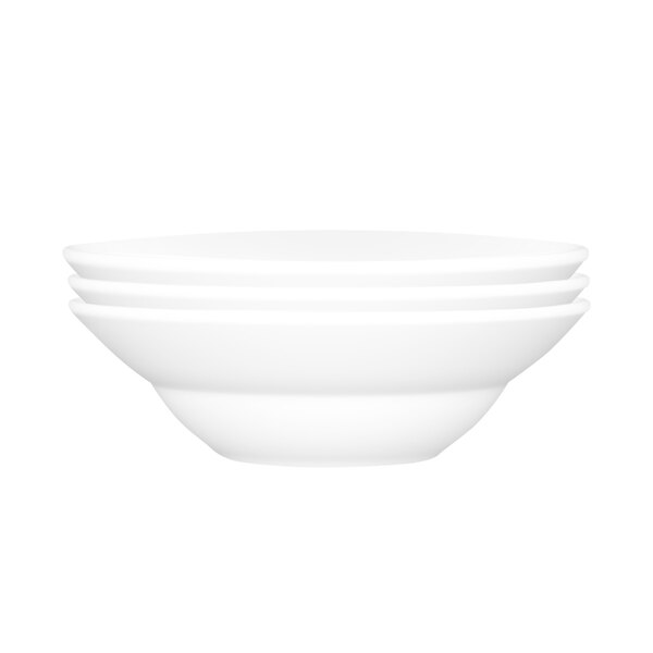 A white bowl with a stack of white bowls on top of it.