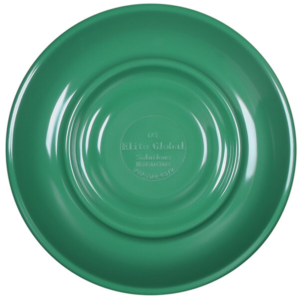 A close-up of a green plate with a circular design and a white rim.