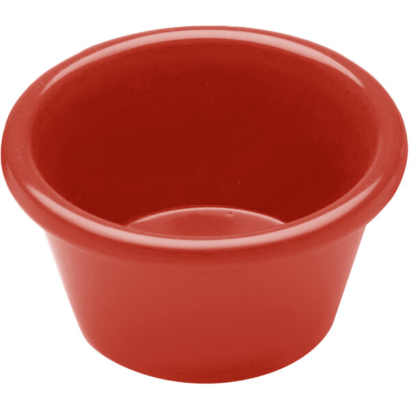 A close-up of a red Elite Global Solutions melamine ramekin.