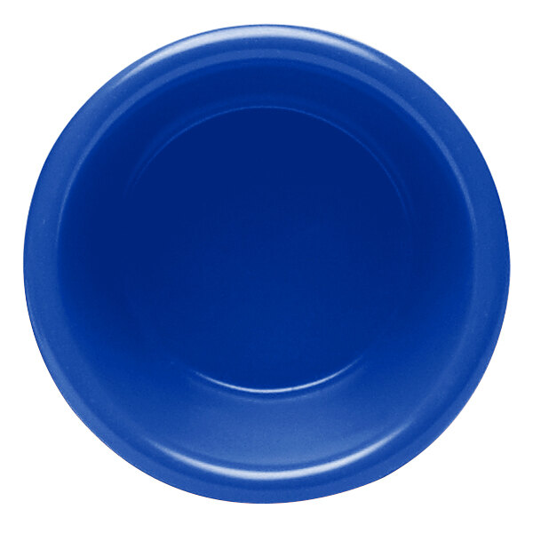 A purple melamine ramekin with a white circle in the middle.