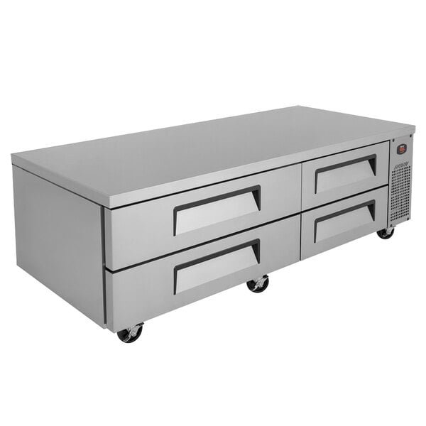 A grey metal cabinet with four drawers on wheels.