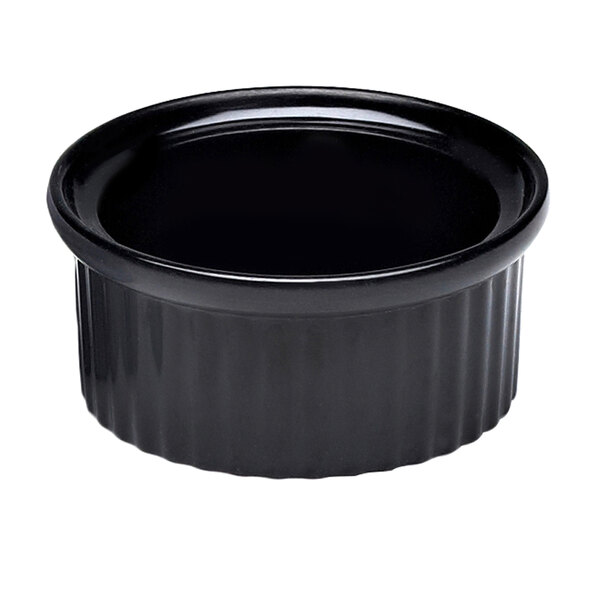 A black fluted melamine ramekin with a black rim.