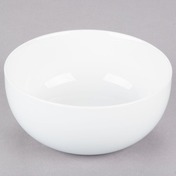 A white 10 Strawberry Street Royal Coupe soup bowl on a gray surface.