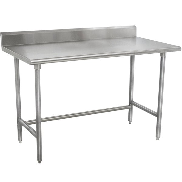 A stainless steel Advance Tabco work table with a stainless steel top.