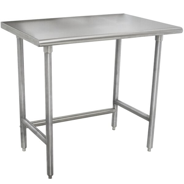 An Advance Tabco stainless steel work table with an open base.