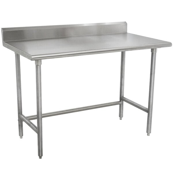 A stainless steel Advance Tabco work table with adjustable legs.