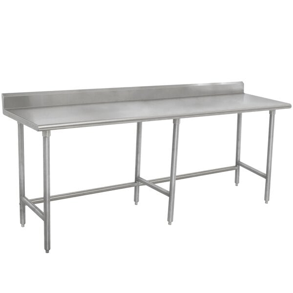 A stainless steel Advance Tabco work table with a 24" x 60" work top and 24" backsplash and legs.