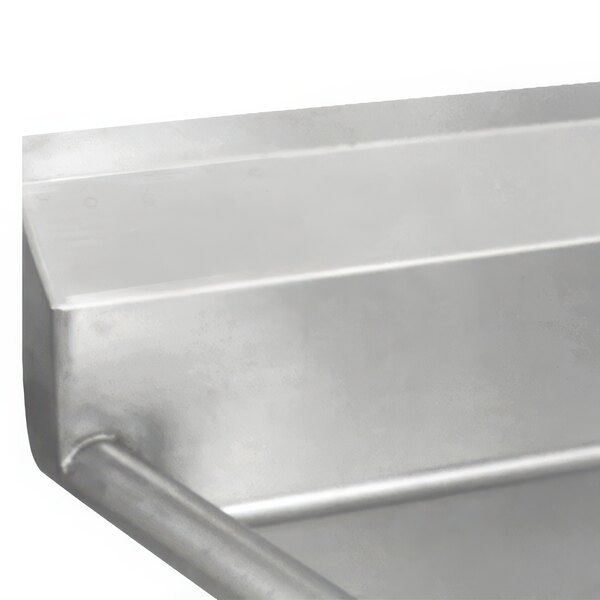 A stainless steel Advance Tabco commercial sink with left drainboard.