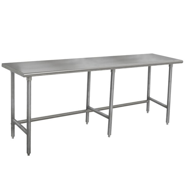 An Advance Tabco stainless steel work table with legs.