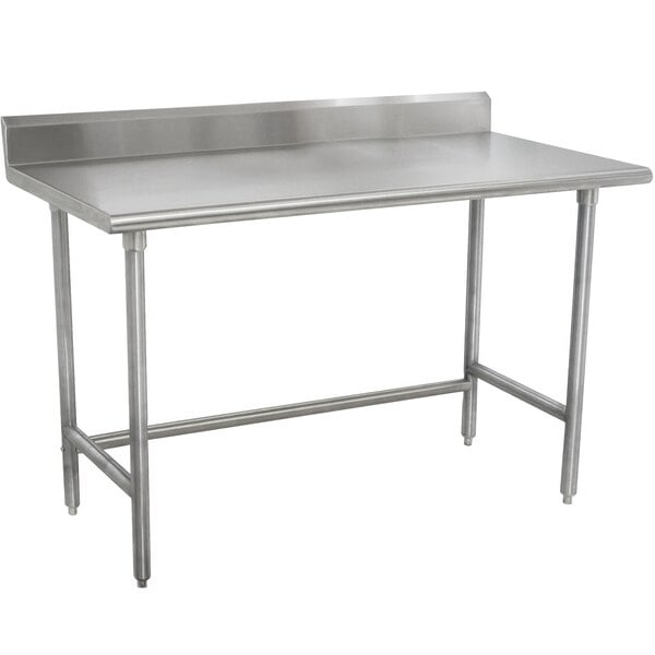 A stainless steel Advance Tabco work table with a 24-in work top and 5-in backsplash.