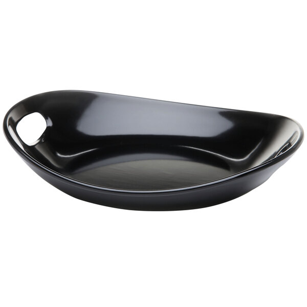 A black oval melamine platter with handles.