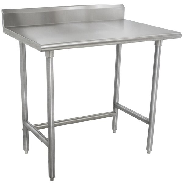 A stainless steel Advance Tabco work table with a 24-in work top and 5-in backsplash.