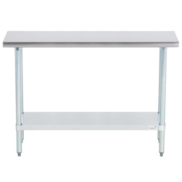 A stainless steel work table with a shelf.