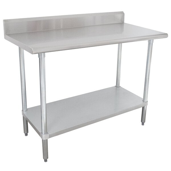 A stainless steel Advance Tabco work table with undershelf.