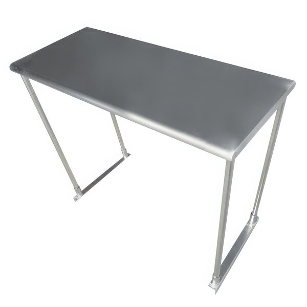 An Advance Tabco stainless steel table mounted overshelf on a stainless steel table.