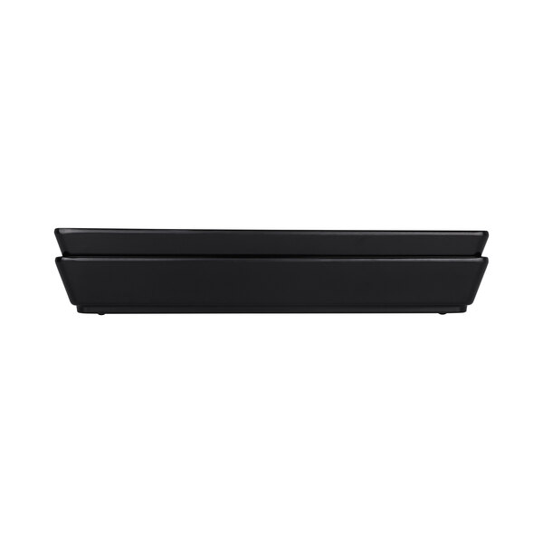 A black rectangular melamine bowl with a white interior.