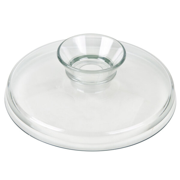 A clear glass lid with a small circular base.