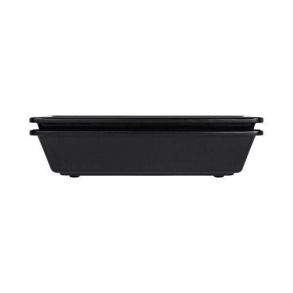 A black rectangular melamine bowl with a white border.
