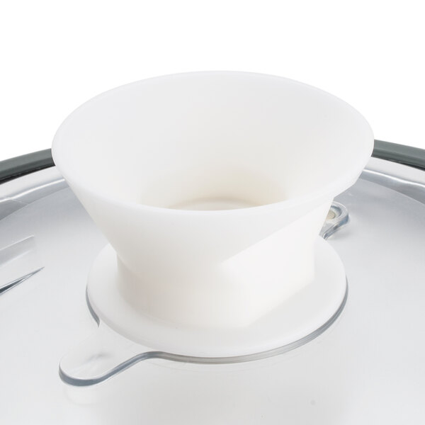 A white Robot Coupe lid assembly with a seal on a table.