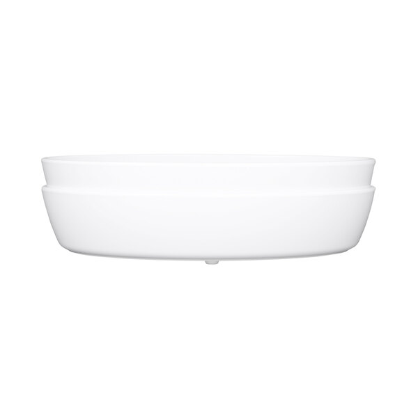 An Elite Global Solutions white oval melamine bowl on a white surface.