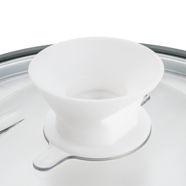 A Robot Coupe lid assembly with seal on a white table.