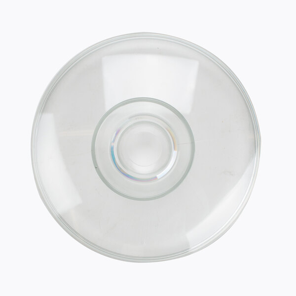 A close-up of a clear glass bowl with a white background.