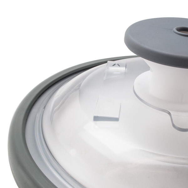A Robot Coupe lid assembly with a seal on a food container.