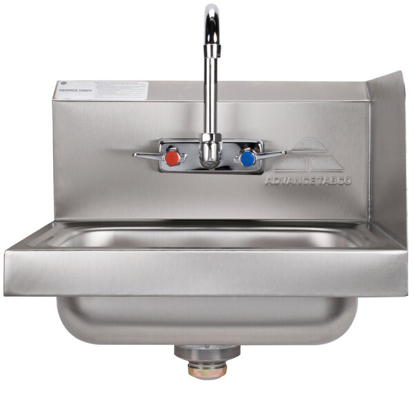 A stainless steel Advance Tabco hand sink with a faucet.