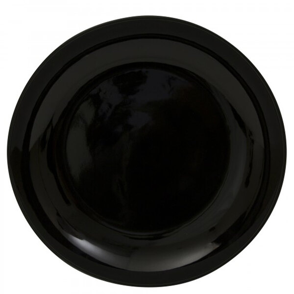 A close-up of a black 10 Strawberry Street porcelain charger plate.