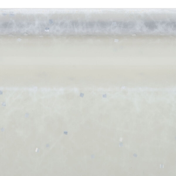 A white rectangular fiberglass Cambro tray with silver and blue squares.