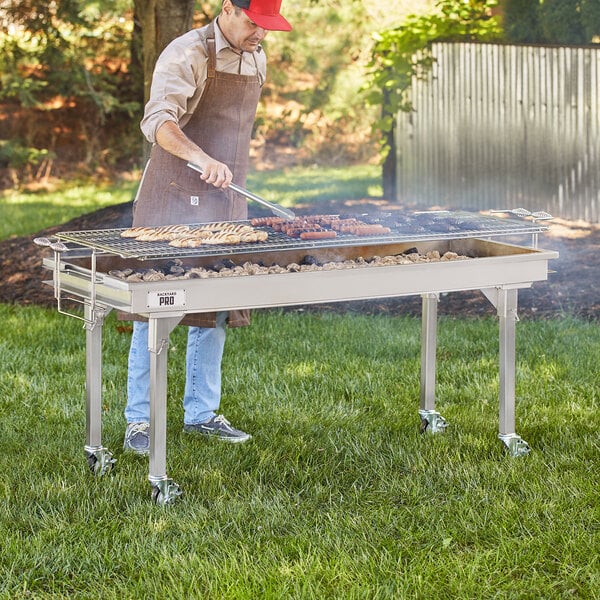 A man cooking food on a charcoal grill