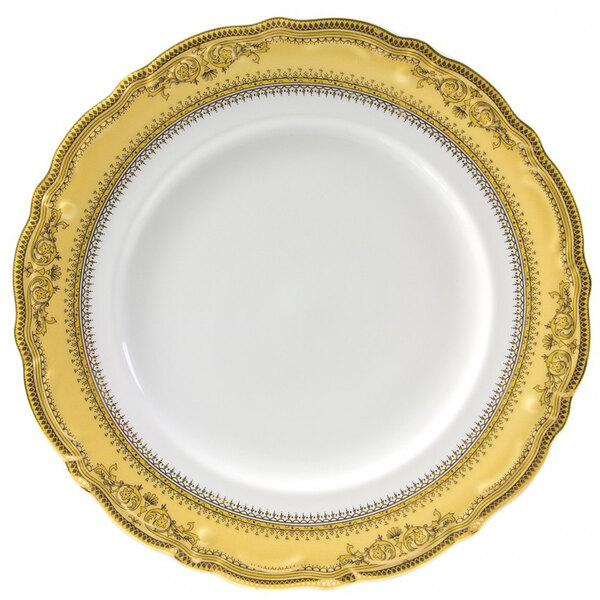 A white porcelain charger plate with a gold border.