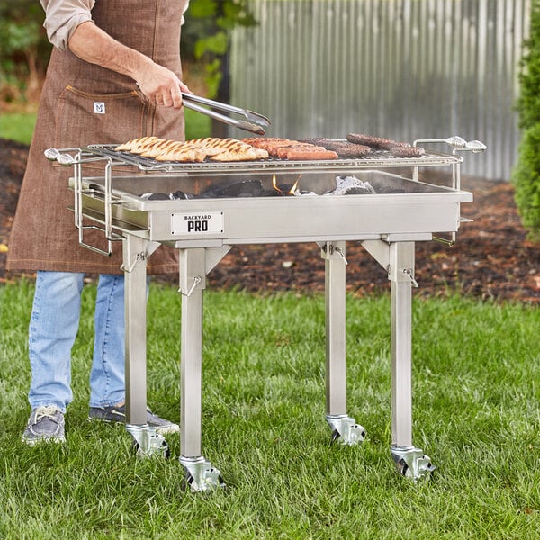 A man grilling on a portable outdoor grill