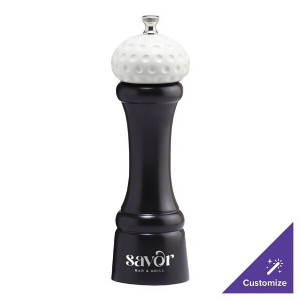 A black pepper mill with the word "Savor" in white.