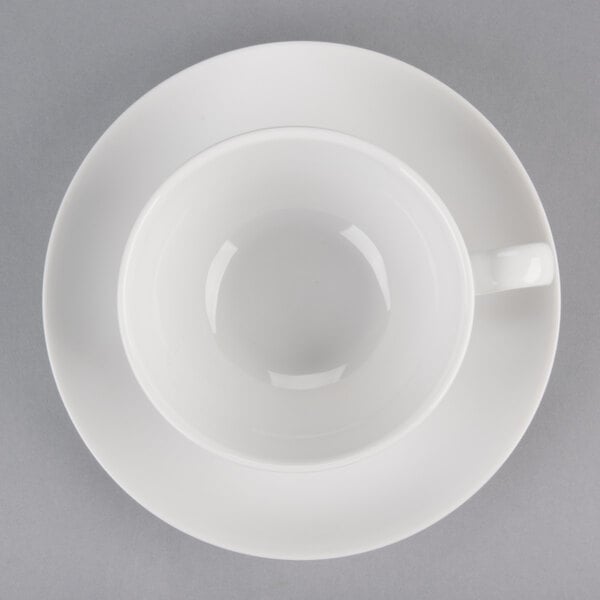 A white 10 Strawberry Street Royal Coupe cup and saucer on a white surface.