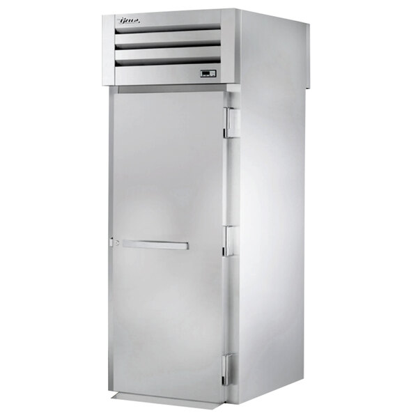 A stainless steel True Spec Series roll-through refrigerator with a solid door.