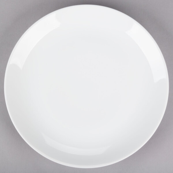 A 10 Strawberry Street Royal Coupe white porcelain plate with a white rim on a gray surface.