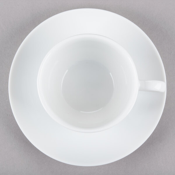 A 10 Strawberry Street white porcelain cup and saucer on a white surface.
