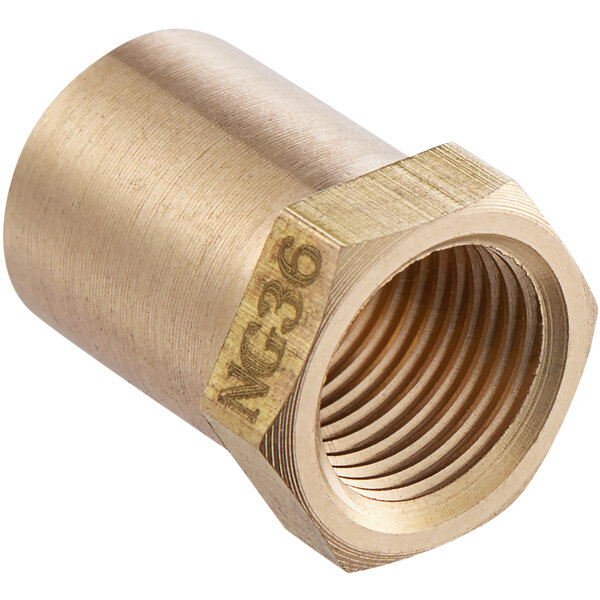 A brass Cooking Performance Group natural gas orifice with a gold metal nut.