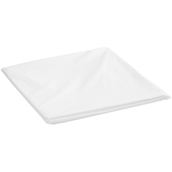 A white folded Creative Converting plastic table cover.