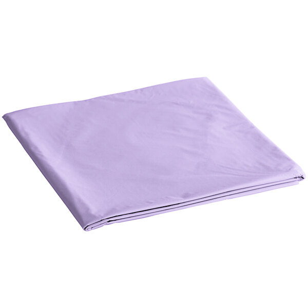 A folded Creative Converting Luscious Lavender Purple table cover on a white background.