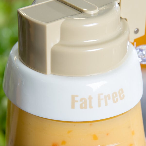 A Tablecraft plastic bottle collar with beige lettering that says "Fat Free" on a white background.