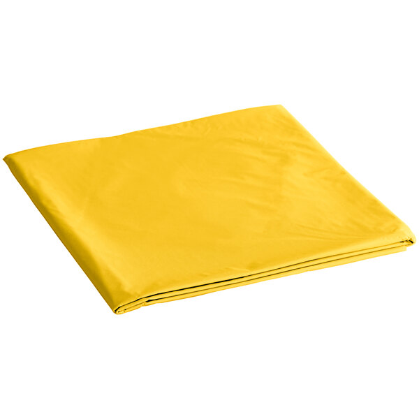 A yellow folded table cover with a white background.