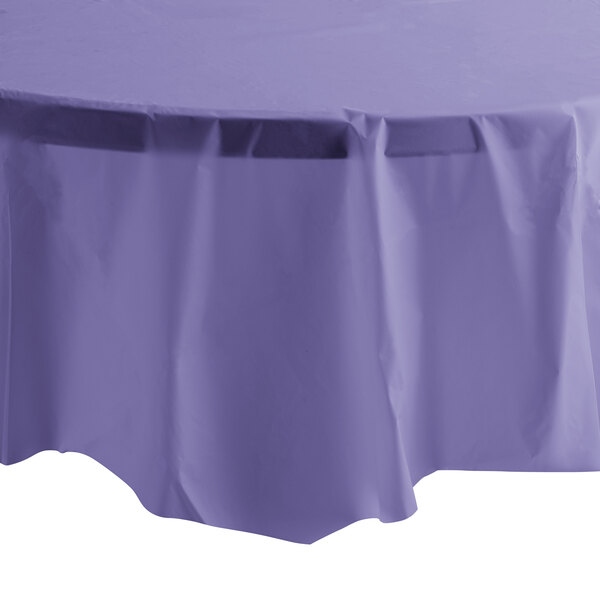 A purple Creative Converting plastic table cover on a white table.