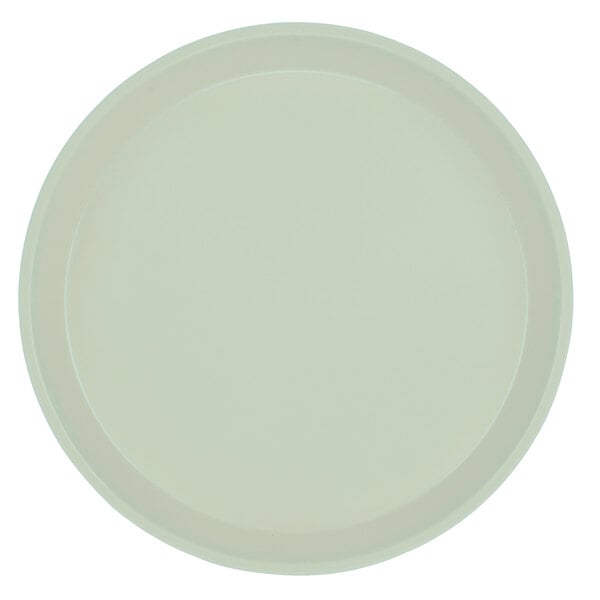 A white round Cambro fiberglass tray with a round rim.