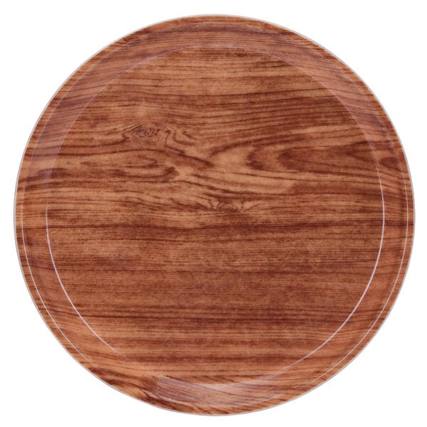 A round Java teak Cambro tray with a white rim.