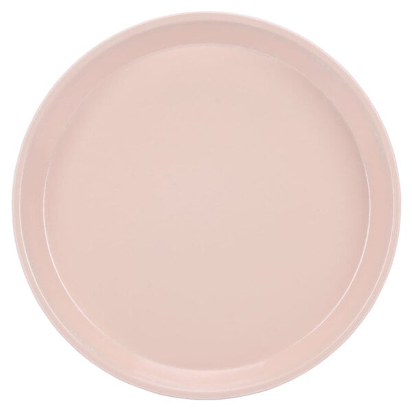 A close-up of a pink Cambro cafeteria tray.