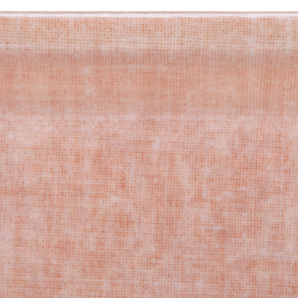 A close up of a toffee colored fabric with a square pattern.