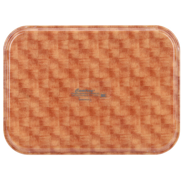 A rectangular plastic tray with a brown and orange basketweave pattern.