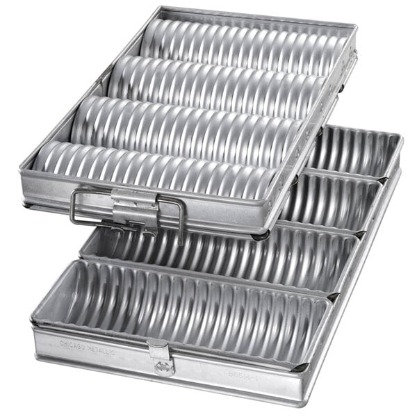 A Chicago Metallic bread pan set with 4 round compartments.
